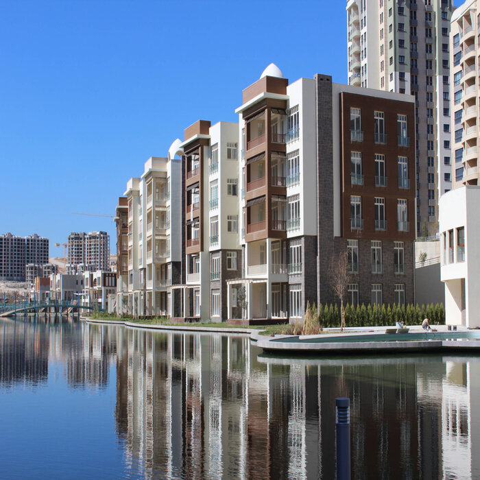 Residential buildings on the banks of the lagoon in the “Antepia” villa complex in Gaziantep, Turkey