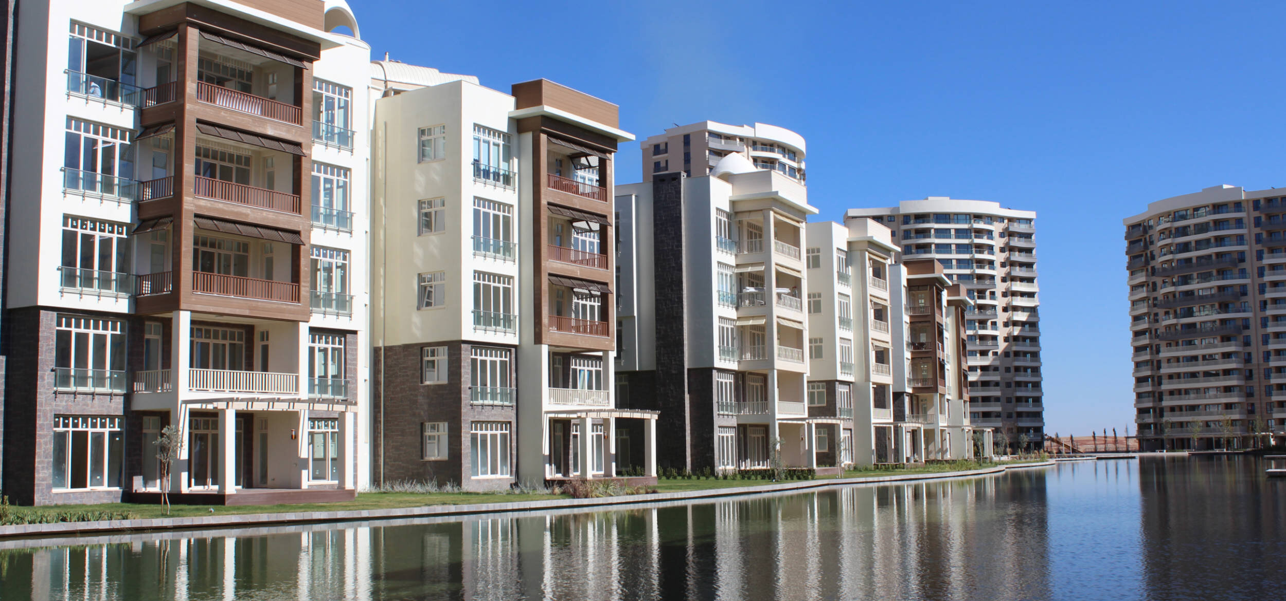 The Balena lagoon landscape in the “Antepia” villa complex in Gaziantep, Turkey, with modern houses on the shore