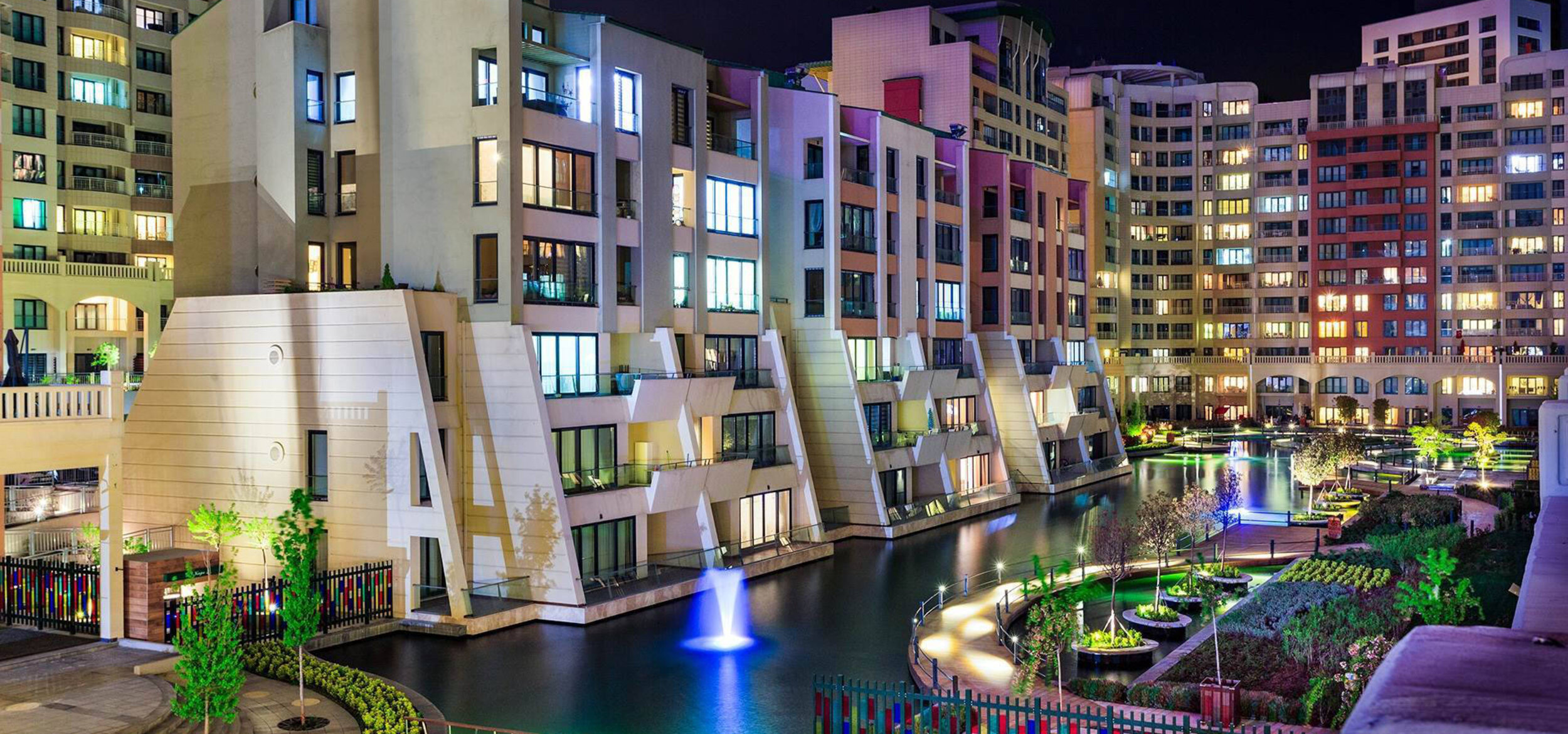 Modern residential buildings with direct waterfront storage in the exclusive residential district of Altin Oran in Turkey