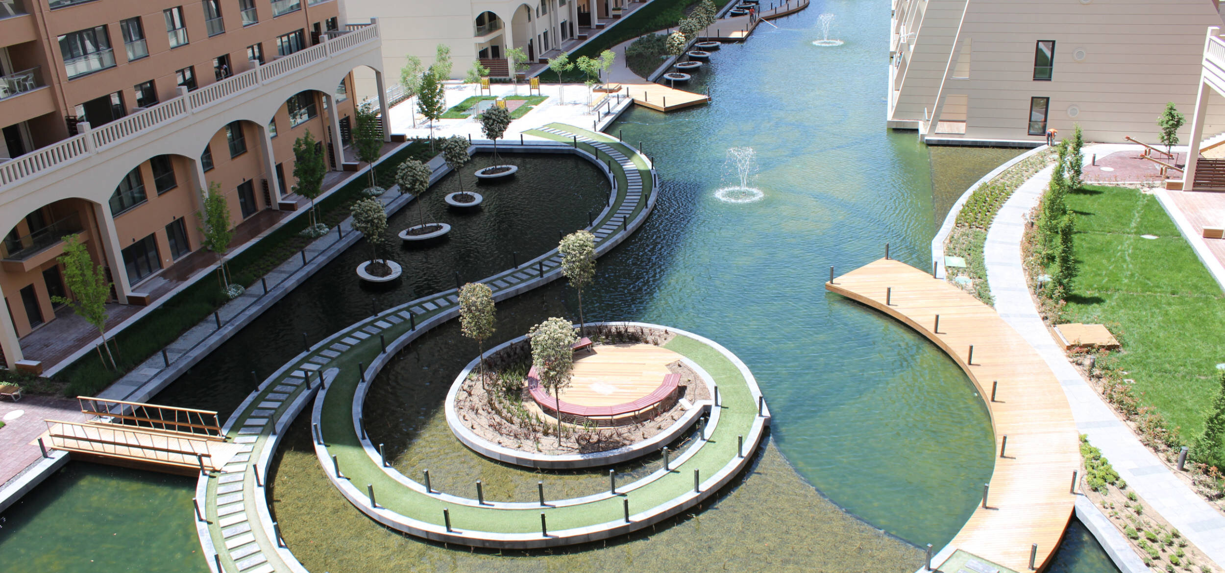 A modern, snail shell-shaped walkway in the lagoon of Altin Oran